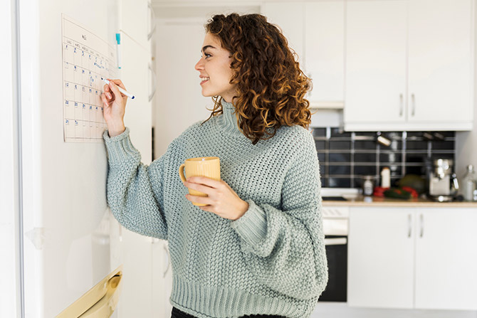 Woman using her home calendar