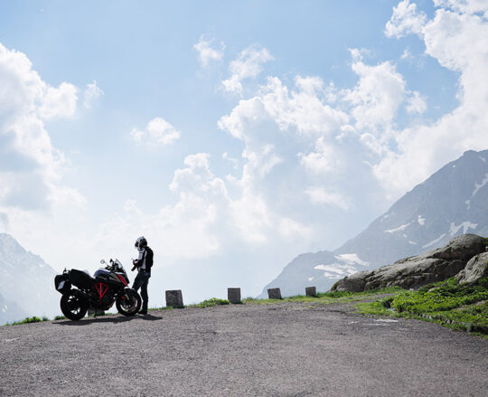 Motorcycle stopped at a viewpoint in the mountains
