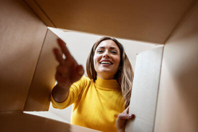 Woman looking inside a moving box