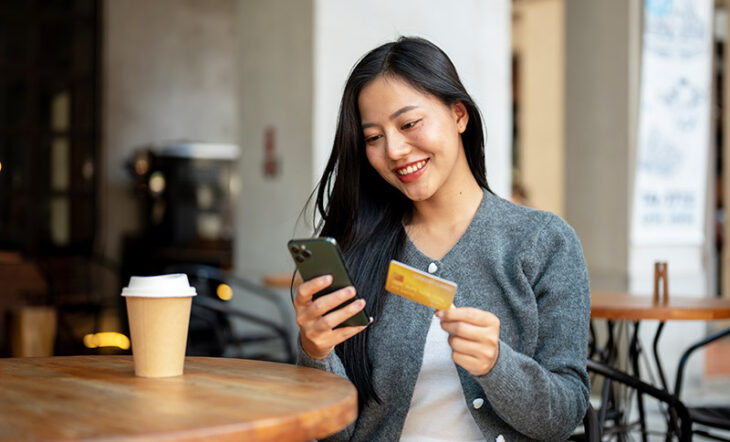 Woman using credit card