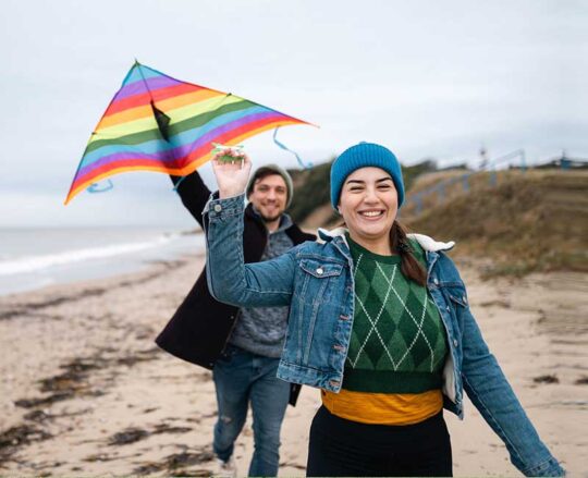 couple flying kite