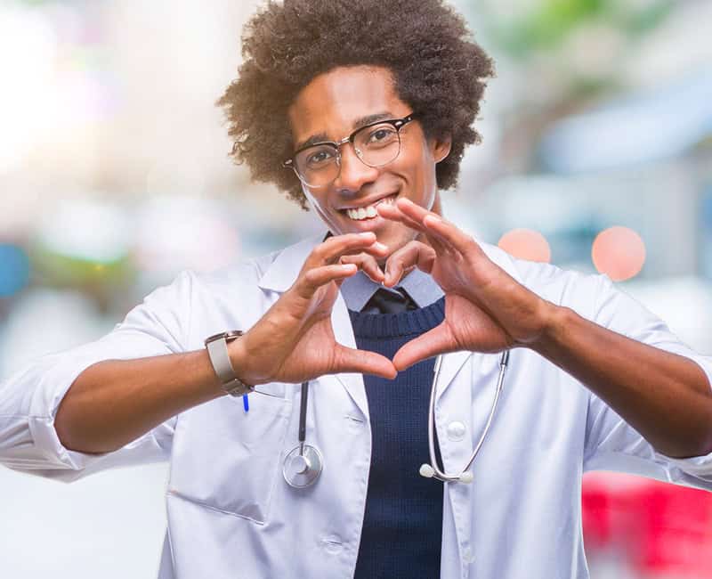 doctor with heart gesture