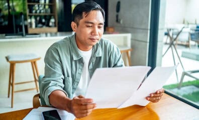 man reviewing auto insurance policy