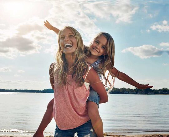 mom and daughter on beach