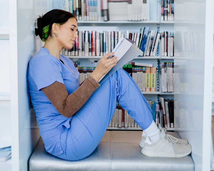 nurse sitting in library
