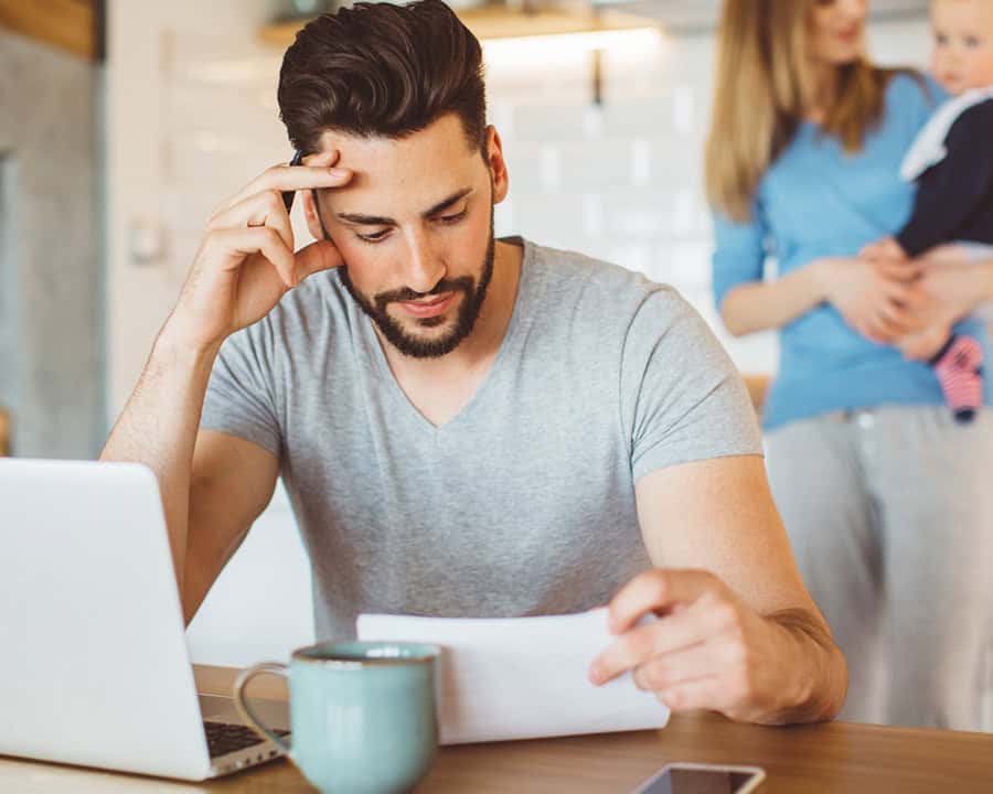 man working on bills