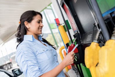 woman paying for gas