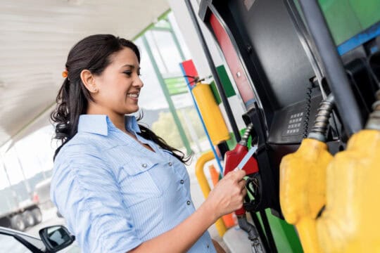 woman paying for gas