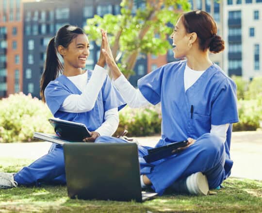 two nurses in park