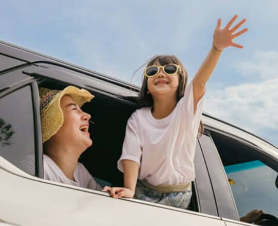 girl having fun in car